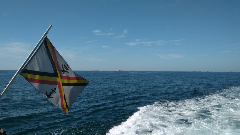 Belgian Navy flag flying at sea