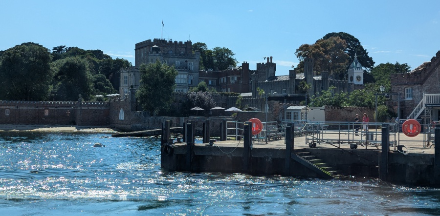 Photo of Brownsea Castle and ferry landing stage from the sea