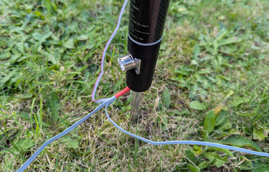 The base of the antenna, showing SO-239 connector and attachment of the ground radials