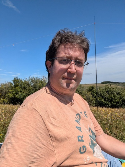 A picture of me operating from a field with an HF dipole antenna