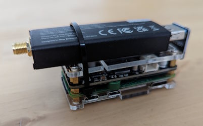 A small stack of Raspberry Pi zero hardware and an SDR dongle