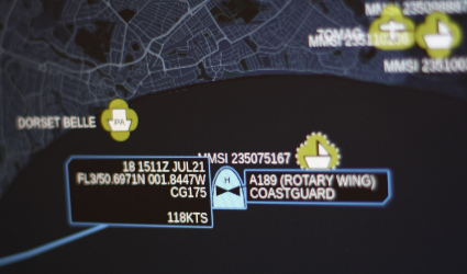 A military tactical software display showing symbols representing boats and planes