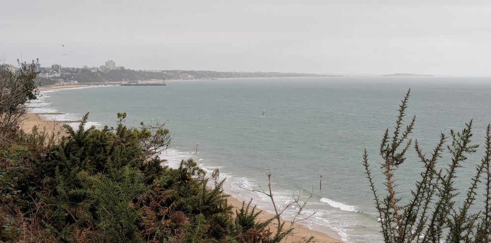 Misty view of Bournemouth beach and pier from Canford Cliffs