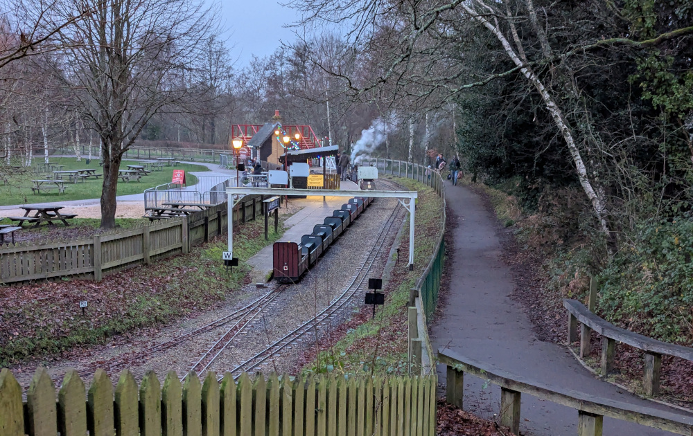 View from behind of a miniature train at a station