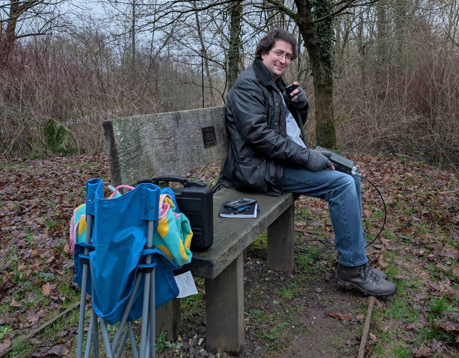 Me sat on a bench using the radio