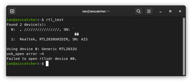 Console showing the results of rtl_test, with two dongles available, one with a corrupted name that could not be accessed