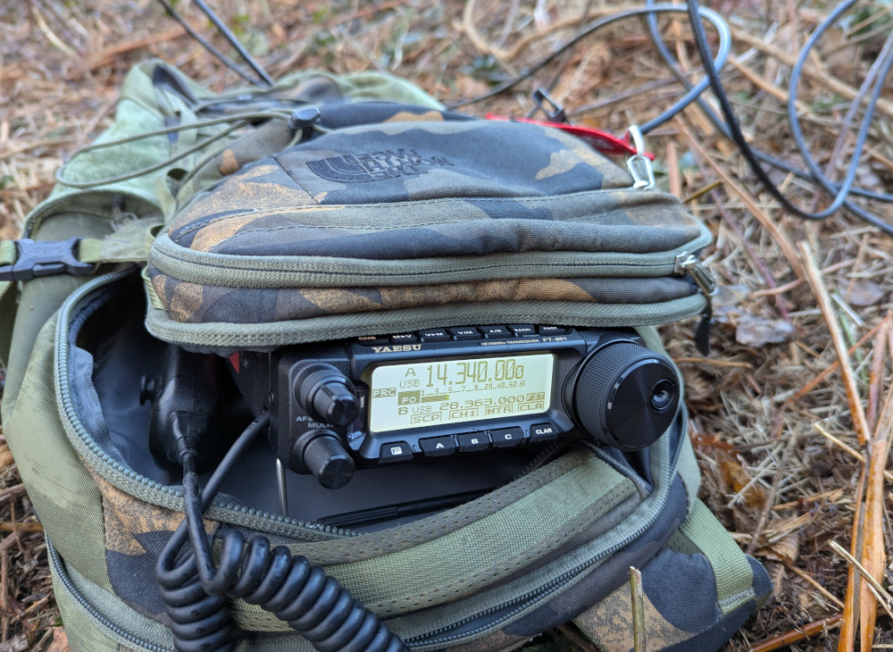 Yaesu FT-891 peeking out of a rucksack