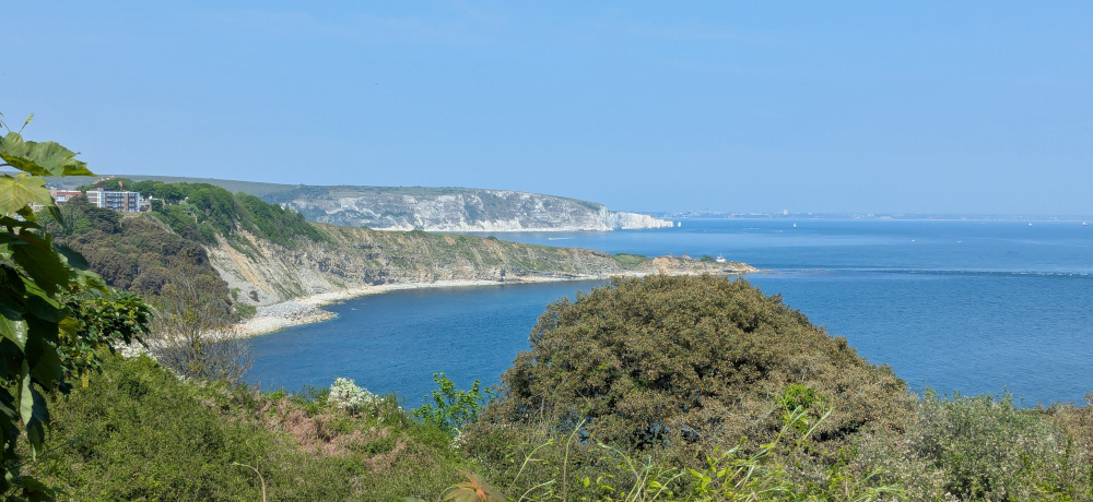 Scenic coastline with two headlands visible, photo taken from a third