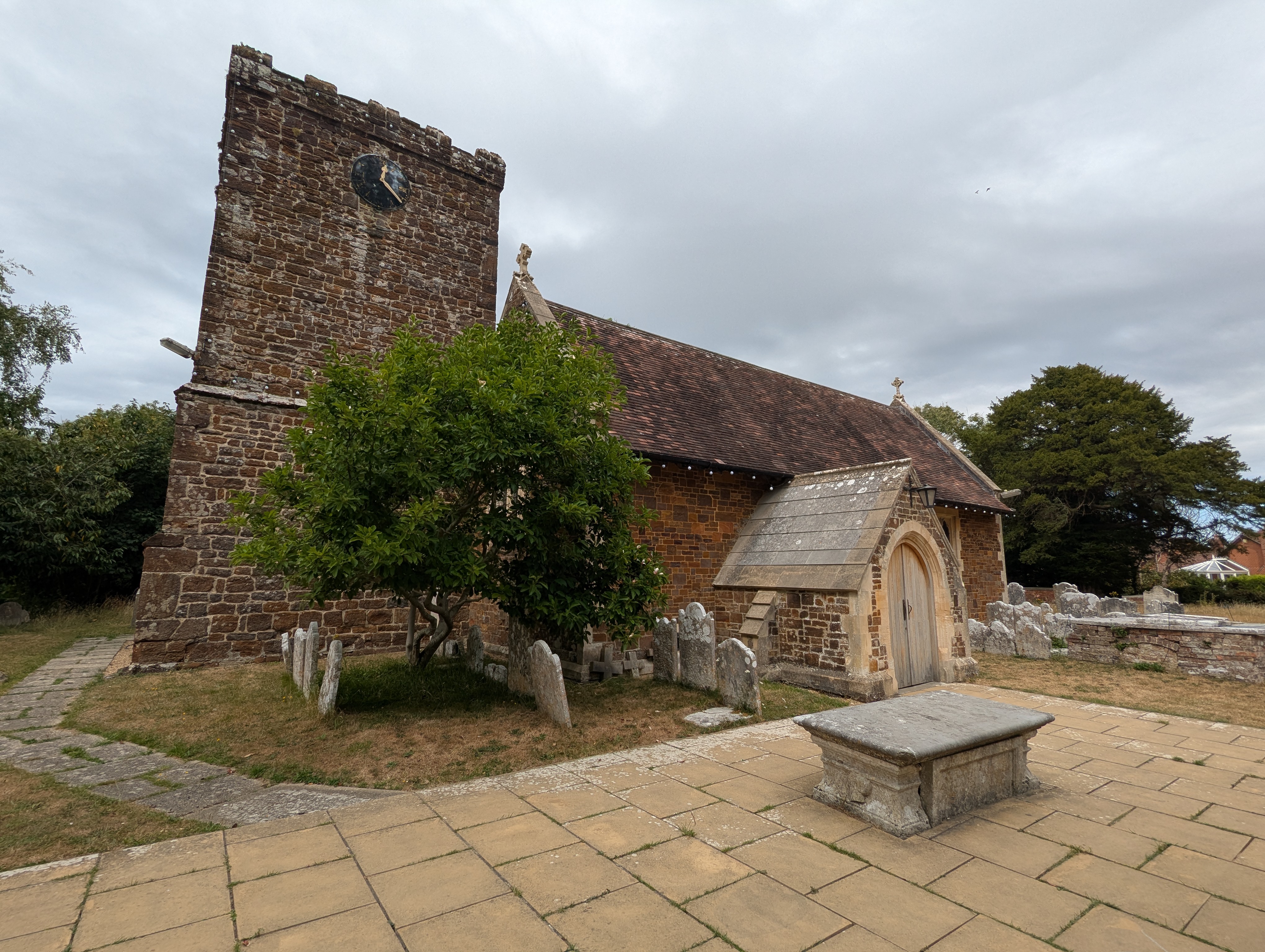 St Andrew's Church in Kinson, Bournemouth. There are some newer additions but the main building and tower are made of red brick and date to the 13th Century.