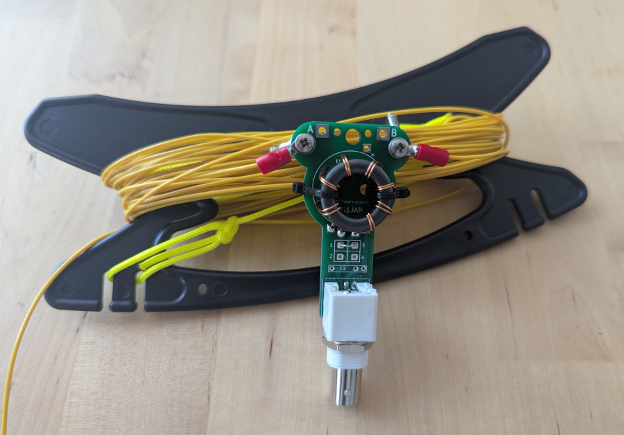 Assembled UniBalun with wire attached, on a winder