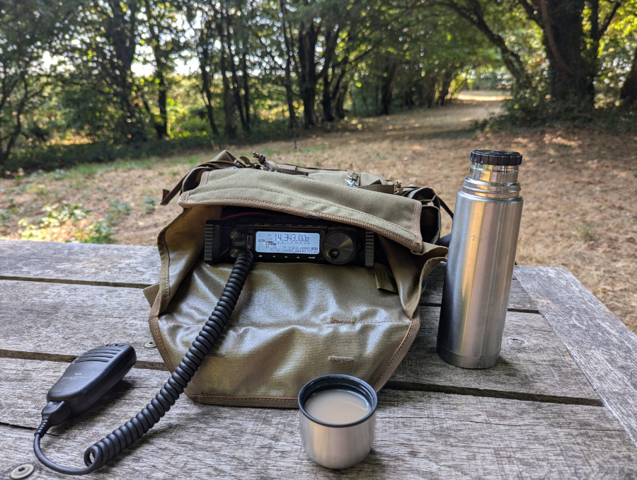 HF kit and a cup of tea on a picnic table
