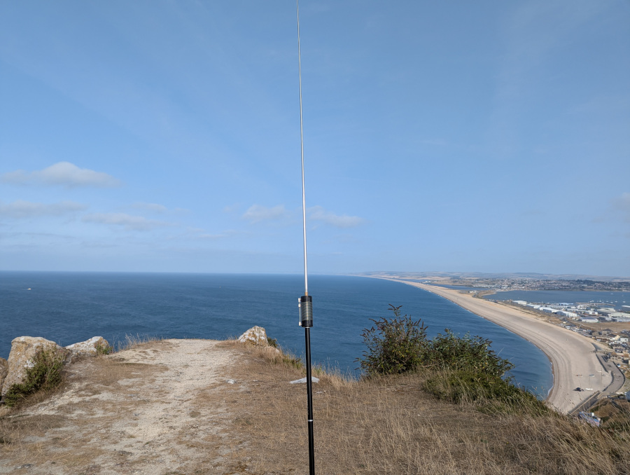 JPC-12 antenna on an outcrop of land with a high vantage point, looking out over Weymouth and Chesil Beach