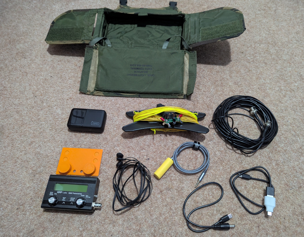 Military camo pouch, with all the radio kit laid out next to it