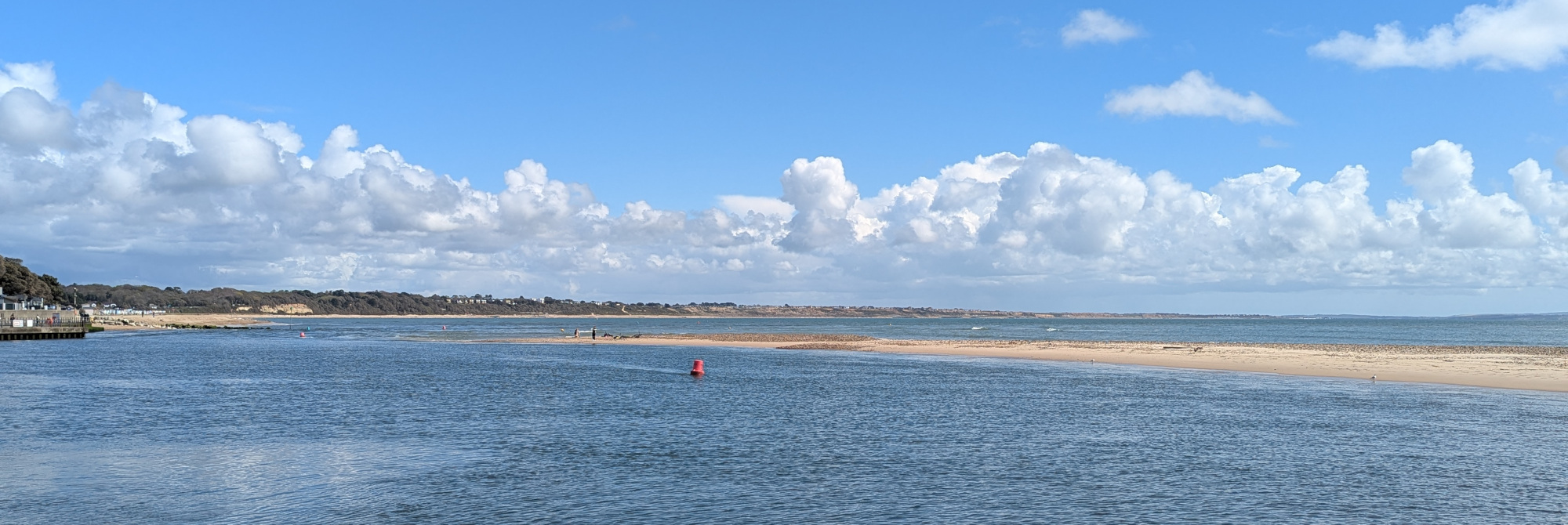 The entrance to Christchurch harbour. A tiny channel in between the quay on which I'm standing and a sandbar just 20 metres or so away.