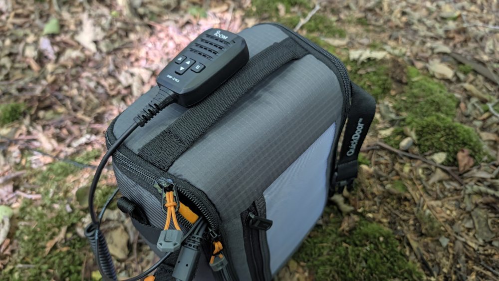 Bag closed, with coax and fist mic cables entering through a gap in the zips