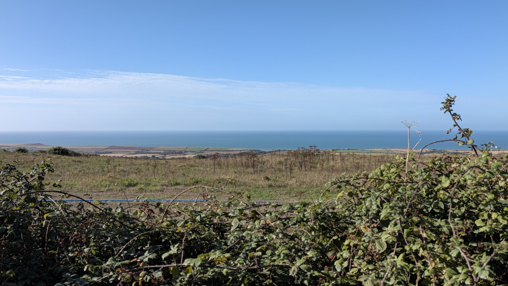 View south over the sea from the path up Brighstone Down