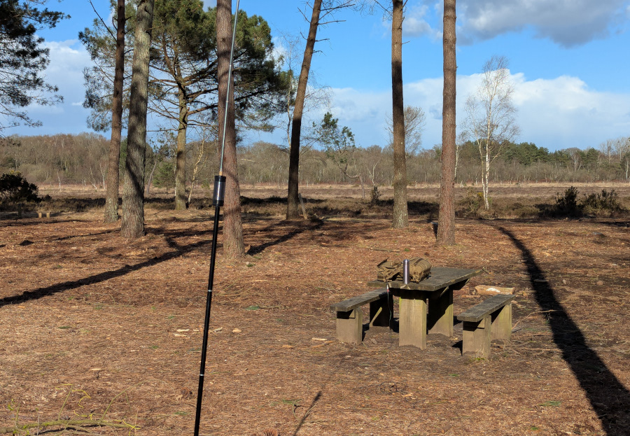 JPC-12 antenna in front of a picnic table, with very brown surroundings