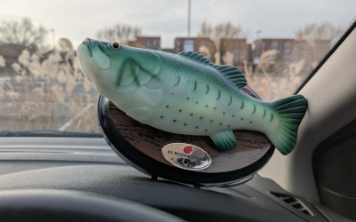 A Billy Bass on a car dashboard