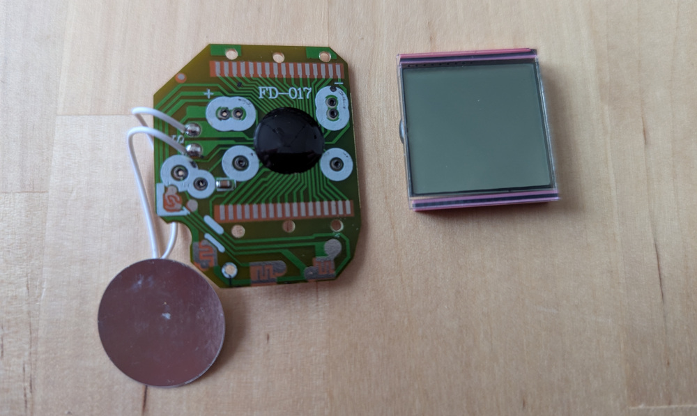 PCB and piezo buzzer, with screen next to it