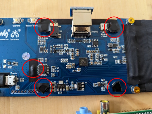 The screen PCB with highlighted points taped over