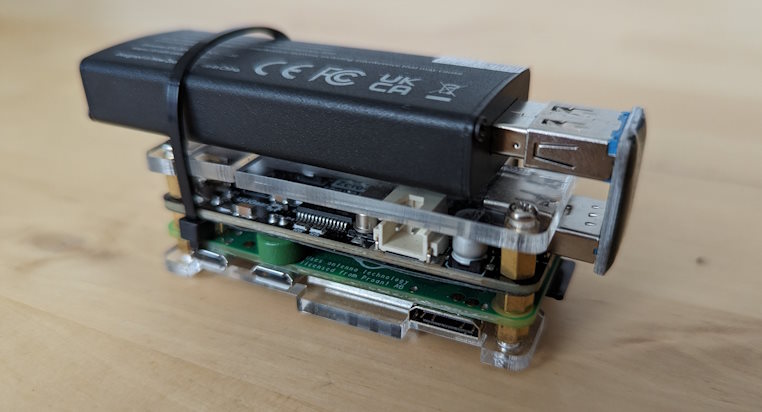 A Raspberry Pi Zero W, USB pHAT and RTL-SDR dongle attached together